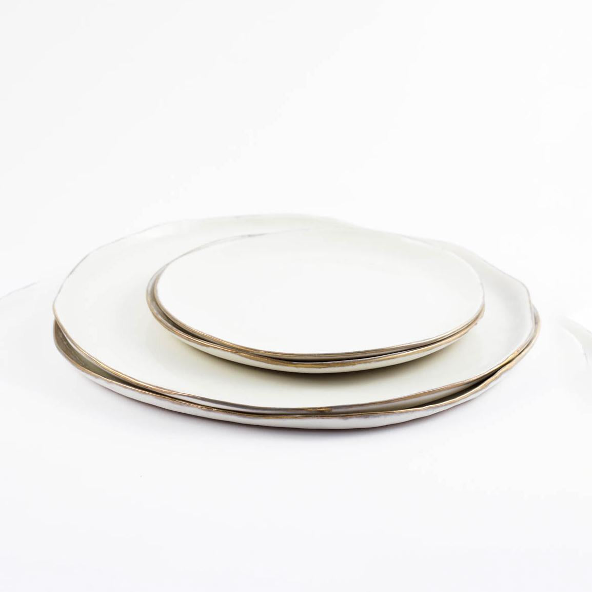 Small ceramic plate with gold plated edge